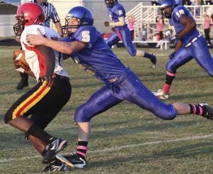 Caleb Dundlow makes a tackle for the Dukes Tuesday. 