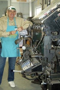 Bill Billings stands beside the linotype machine just acquired by the museum. -- Merle Monahan | Tidewater News