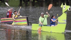 Dan Preston and Lizzie Connor of Blackwater Bessie pull away from The Boat of Many Colors, which is manned by Davis Moore and Wesleigh Kimlick. Bessie came in first, and the latter in fourth during the annual Robo-Regatta on Saturday at Barrett's Landing. -- FRANK DAVIS/TIDEWATER NEWS