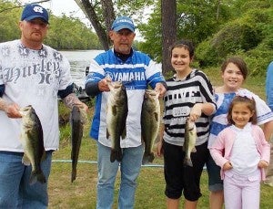 The team of Red Arnold (left) and Mark Wilkerson took first place in the fifthe round of the Three Rivers Bass Tournament series held on the Nottoway River April 28. Also pictured are helpers Bailey Wilkerson, Chyanne Beales and Shea Wilkerson. -- SUBMITTED/ALESIA WILLIAMS