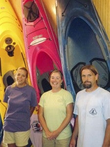 Toni Nolf, center, is the owner of Blackwater Outfitters/Nottoway River Guides, which recently moved to Courtland. With her are Lisa Tiff, staff employee, and Tim McCormick, store manager. Several other people also assist by giving river tours. -- STEPHEN H. COWLES/TIDEWATER NEWS
