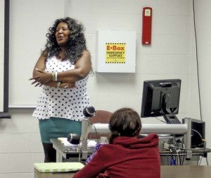 Carletta Perry, career coach and instructor, talks with a group of former dual-enrollment students. -- Cain Madden | Tidewater News