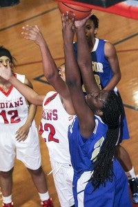 Windsor’s Andrea Magba gets in over Southampton’s Bryona Knight for a rebound. Magba had nine rebounds. -- Cain Madden | Tidewater News