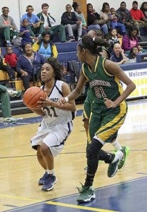 Kayla Powell, who led the Lady Broncos in scoring with eight points, goes to the hoop on Tuesday night. -- Frank Davis