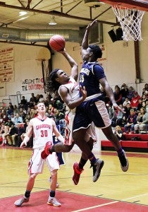 Isle of Wight junior Curtis Waters gets the contact as he looks to convert a layup.  -- Frank Davis | Tidewater News