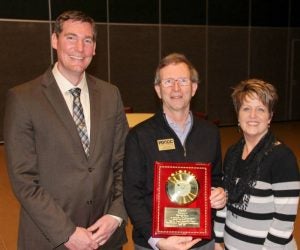 Randy Betz, center, accepts an award for distinguished service and dedication from Dr. Dan Lufkin and Dr. Renee Felts.  -- Submitted | Wendy Harrison